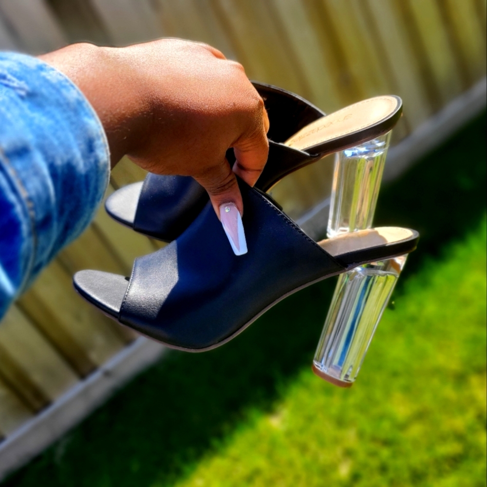 Black slippers with clear heels